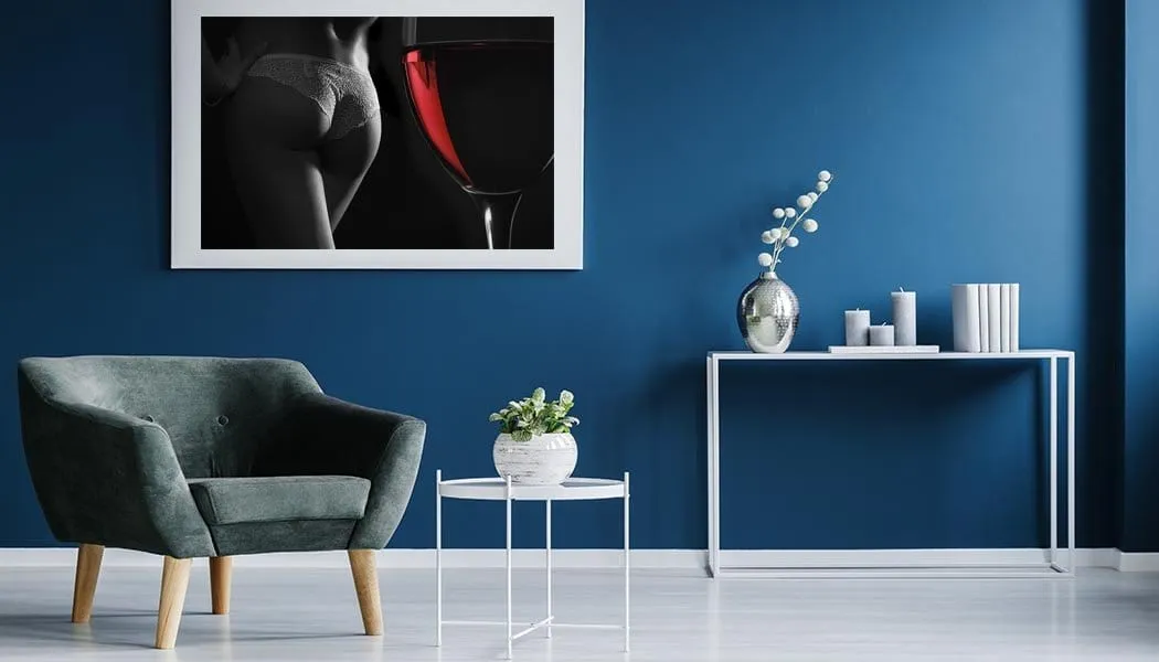 Womans beautiful derriere  and a glass of red wine
